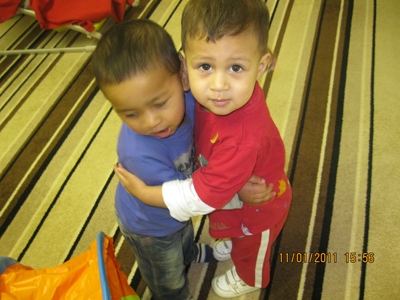 Children Hugging in the Busy Bees room, at Early Learners' Nursery School, Leicester